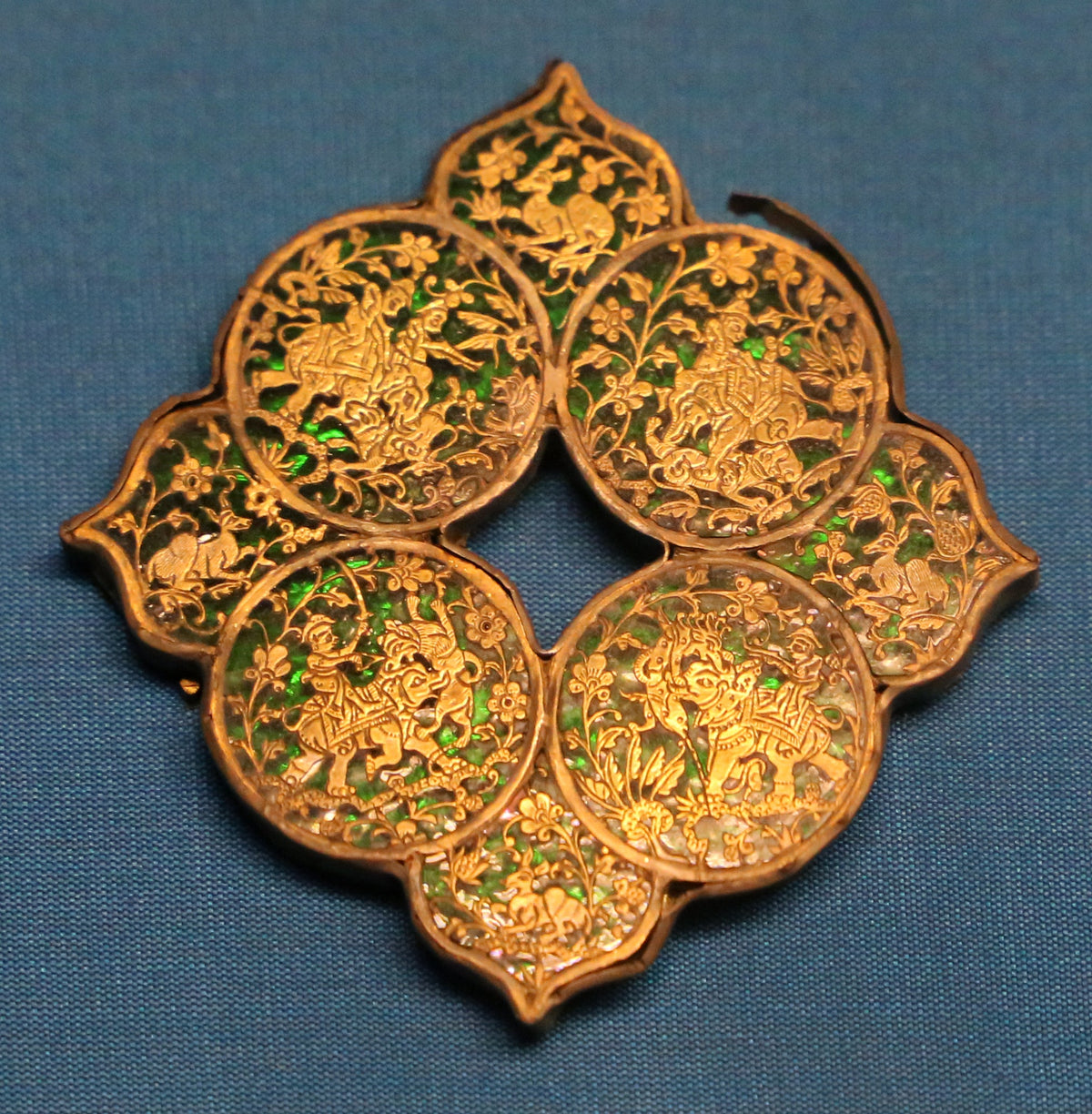 Thewa decorative plaque with figures, animals and foliage against green glass; photograph by Sailko