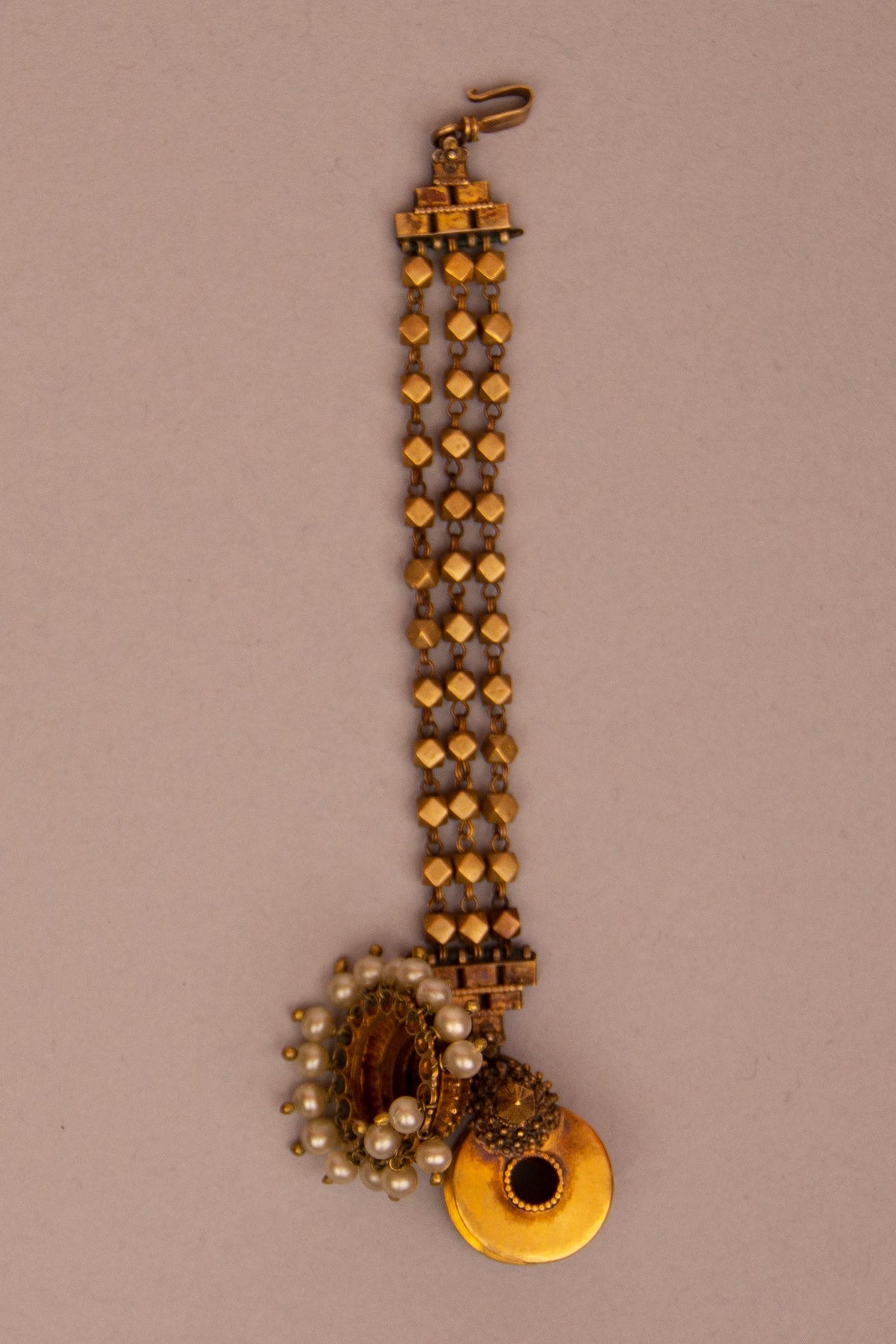 Historic Indian gold and silver hair-and-ear ornament with suspended bell-shaped elements, Metropolitan Museum of Art